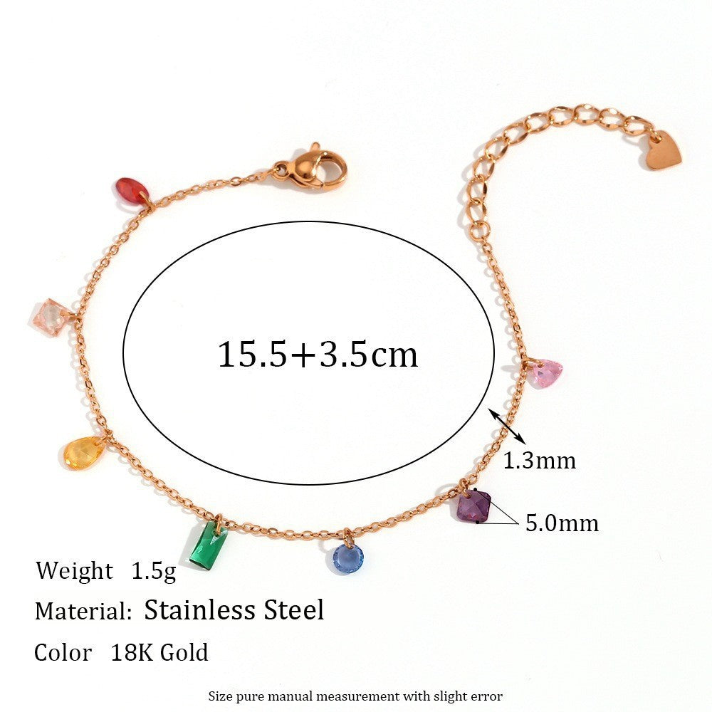 Gold chain bracelet with multiple colorful gemstone charms, shown with measurement annotations indicating 15.5+3.