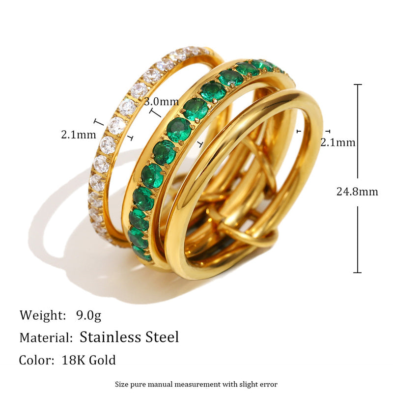 Gold-plated stainless steel ring with green emerald-cut stones and a row of clear cubic zirconia stones, shown with dimension markings and product specifications on a white background.