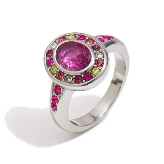 Ring with a pink gemstone and colorful surrounding stones on a white background