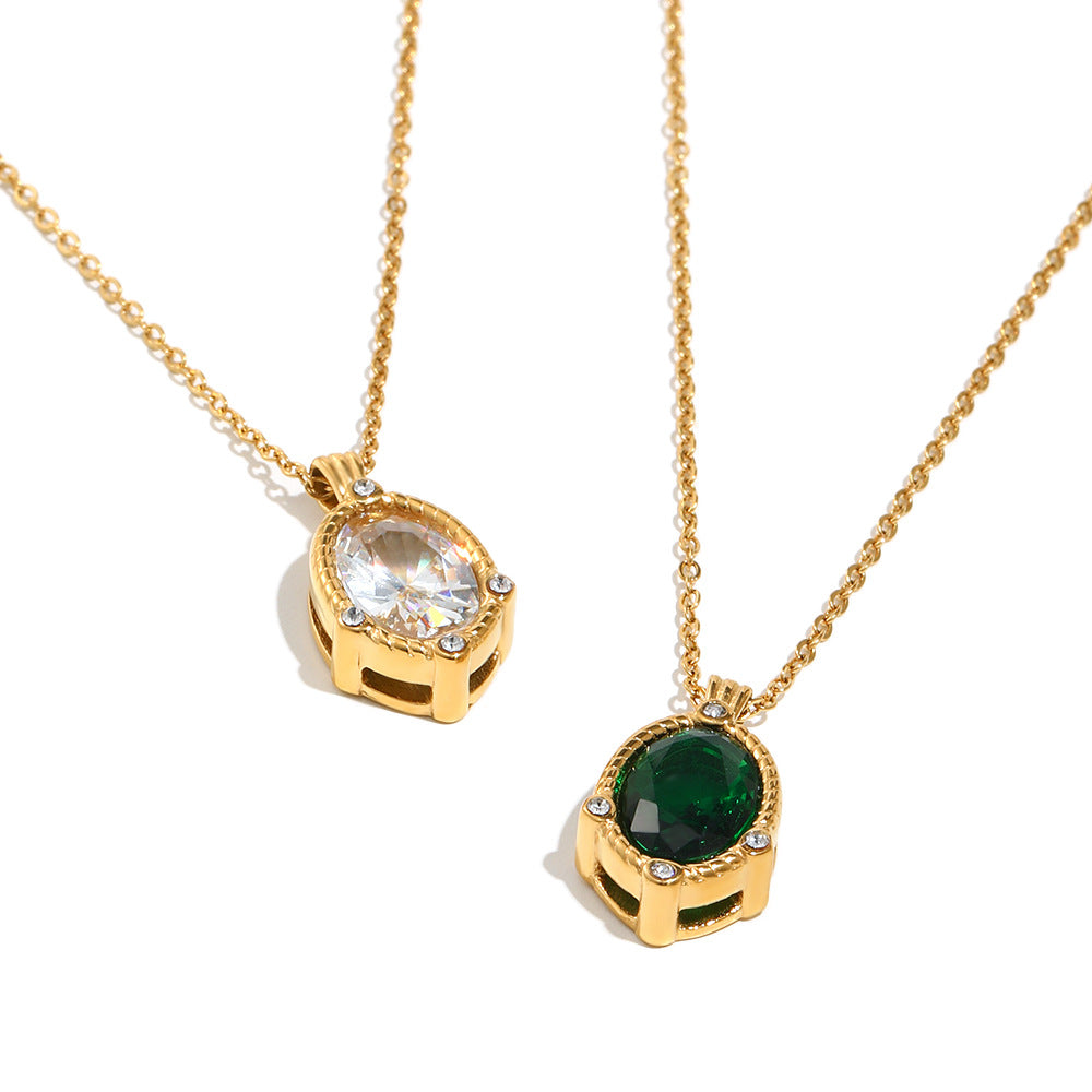 Two gold necklaces with gemstone pendants on a white background