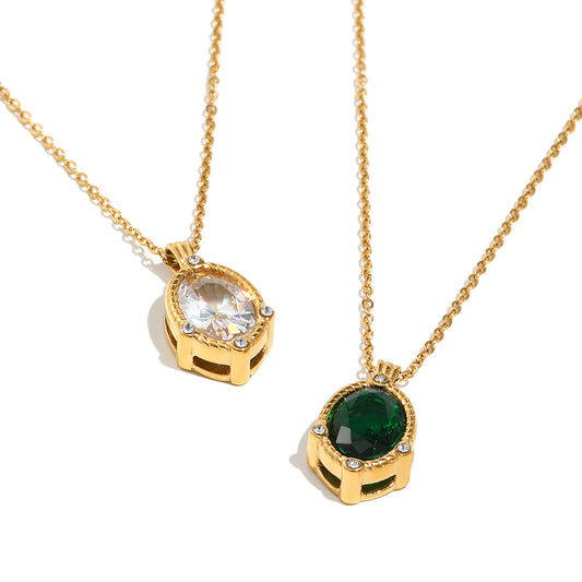 Two gold necklaces with gemstone pendants on a white background