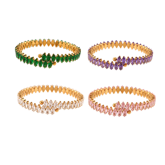 Four gold-plated stretch bracelets arranged in a 2x2 grid on a white background, each featuring a row of faceted gemstones in green, purple, clear, and pink.