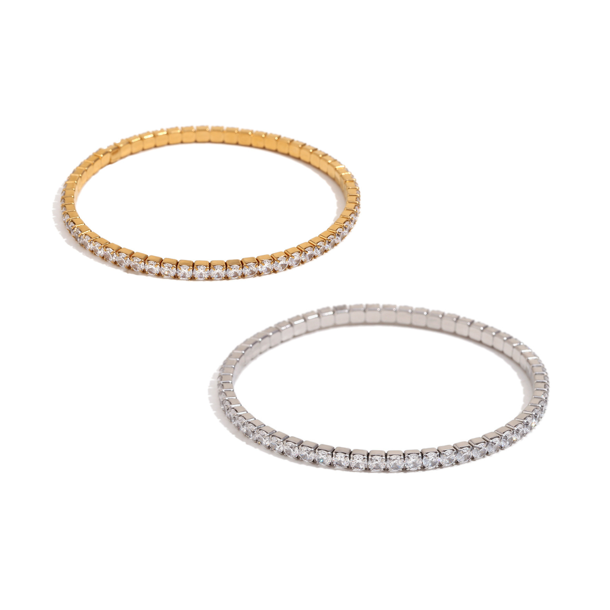 Two tennis-stretch bracelet on a plain white background, one in yellow gold and one in silver-tone metal, both set with clear stones along the front edge.
