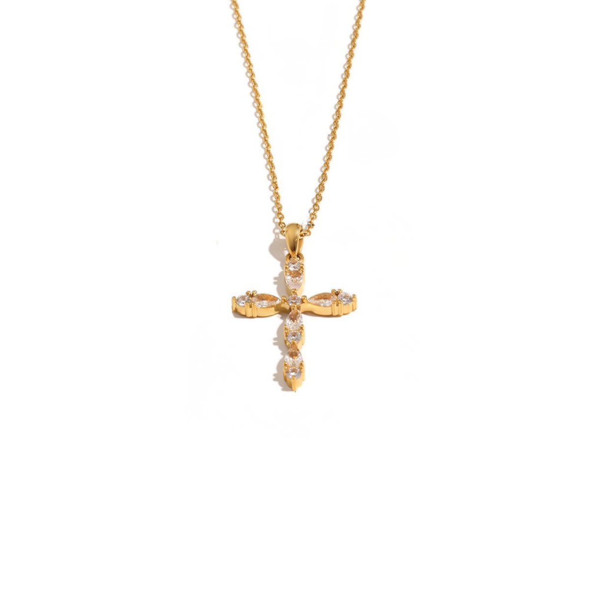 A gold cross pendant necklace adorned with small clear stones, suspended from a delicate gold chain against a plain white background.