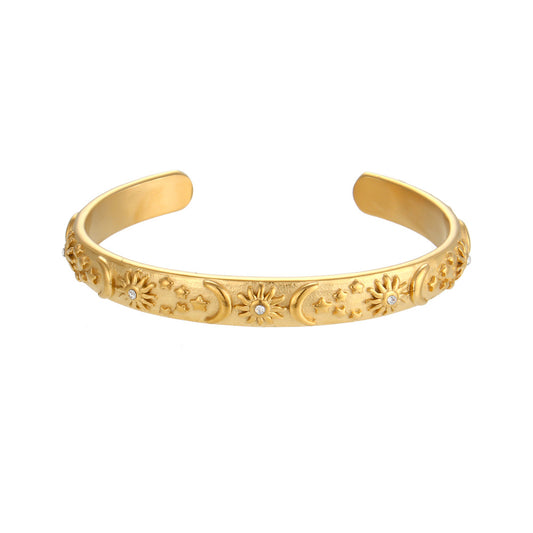 Celestial Star, Moon & Sun Bangle on a white background