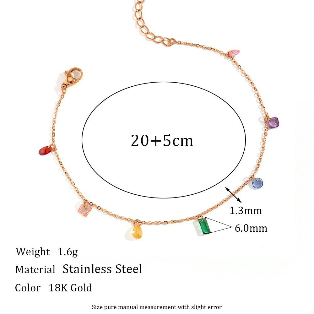 A stainless steel chain bracelet with small multicolored gemstone charms, shown on a white background with measurement annotations indicating 20+5cm length, 1.3mm chain width, and 6.