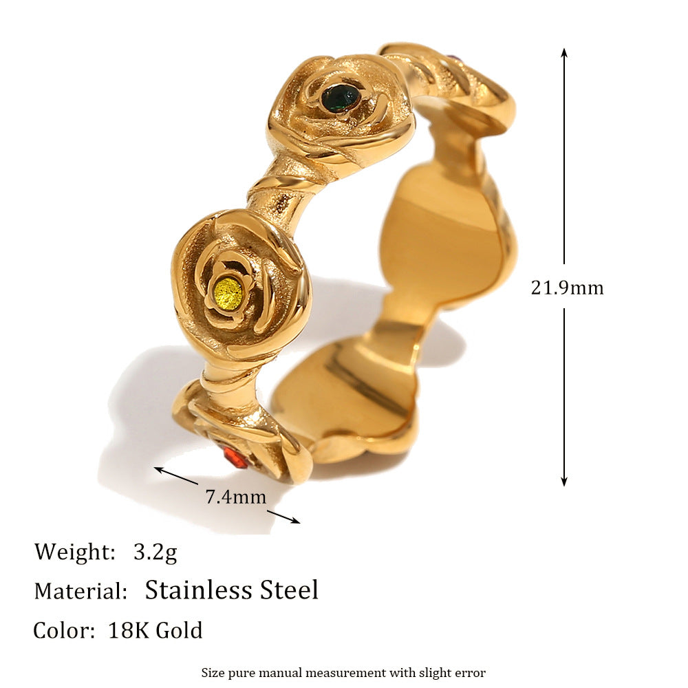 Gold-plated stainless steel ring with rose-shaped details and small colored gemstones, shown with dimension markers (21.9mm width, 7.