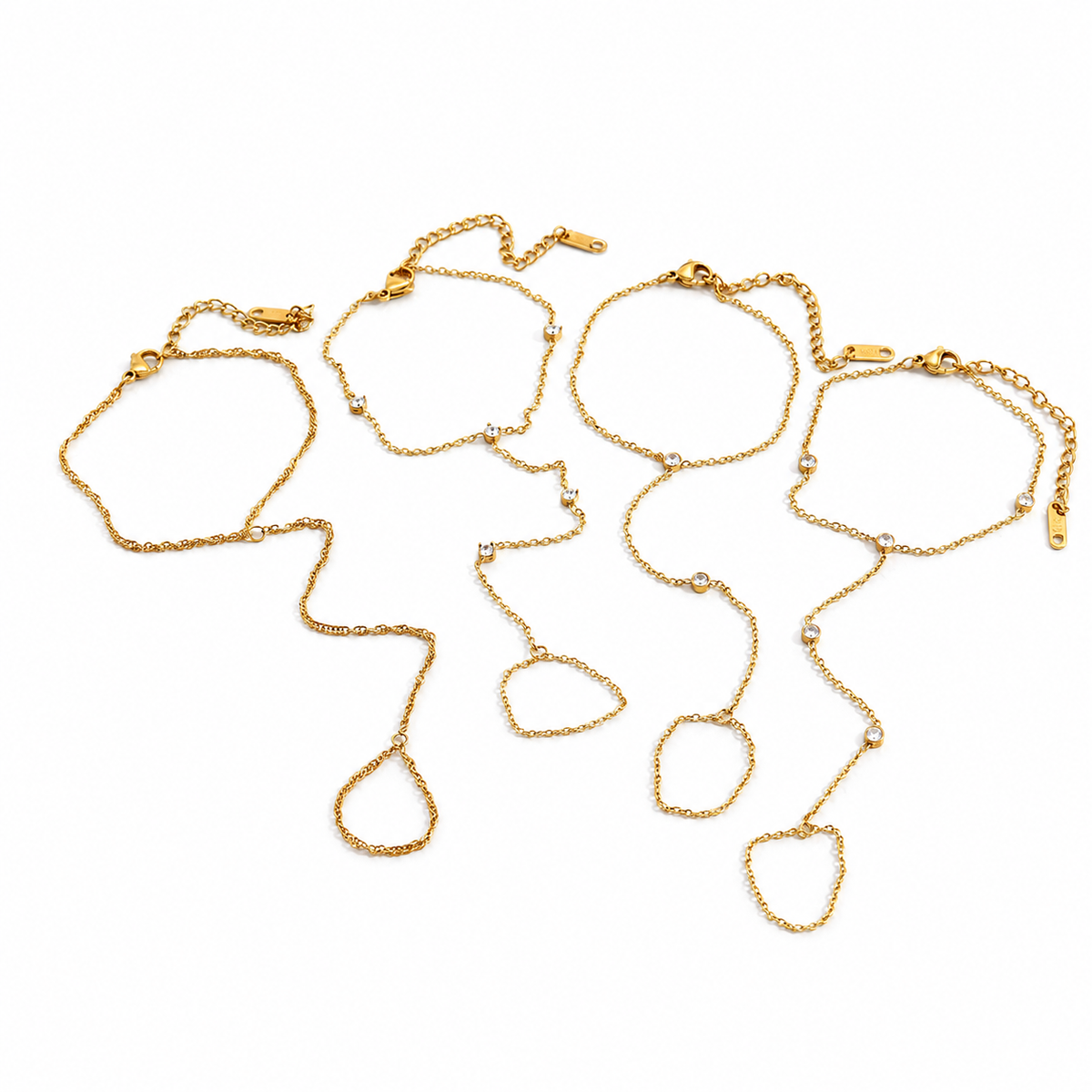Four delicate gold chain bracelets with irregular loop pendants, arranged on a plain white background.