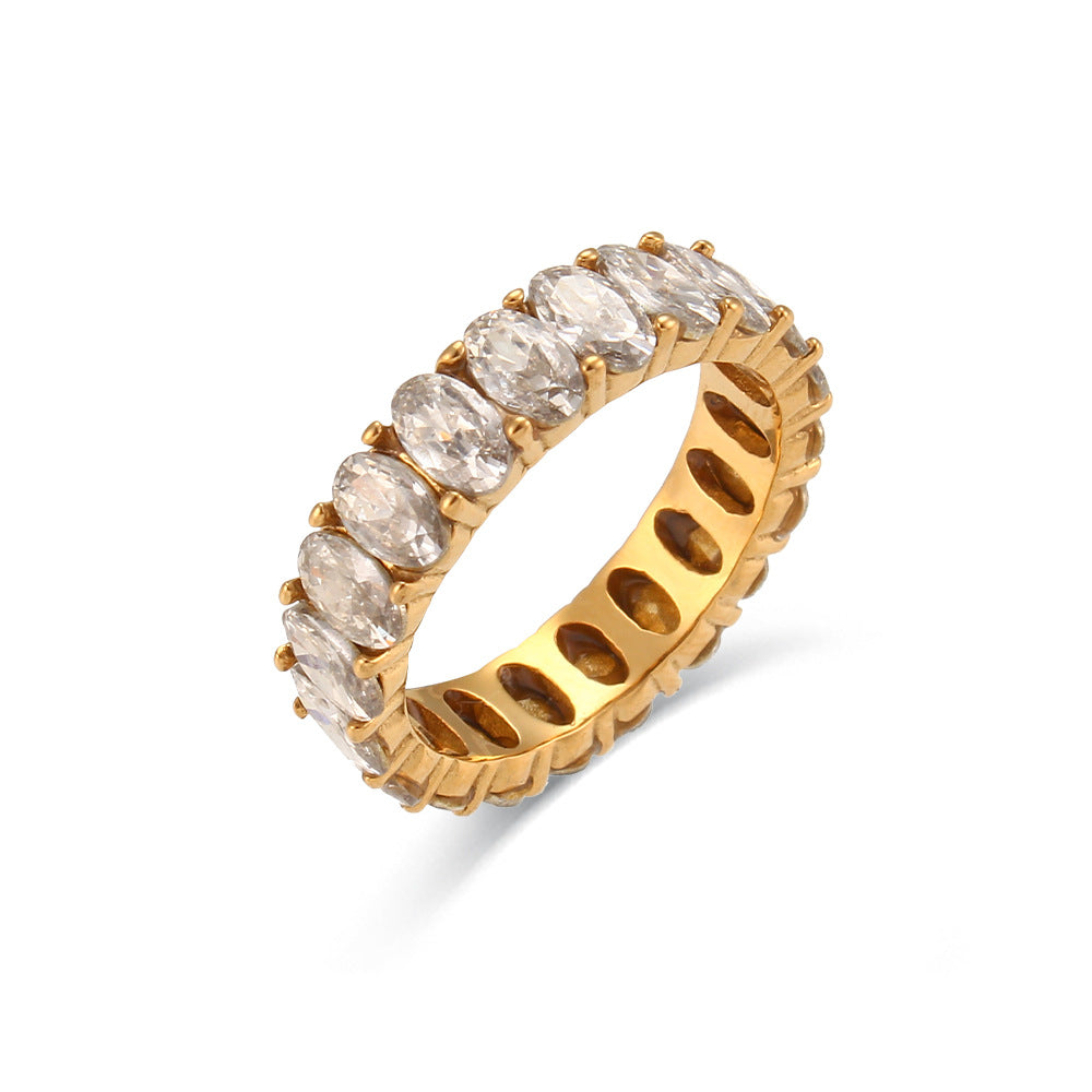Gold ring with marquise-shaped diamonds on a white background