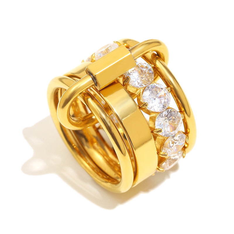 Gold ring with diamond accents on a white background