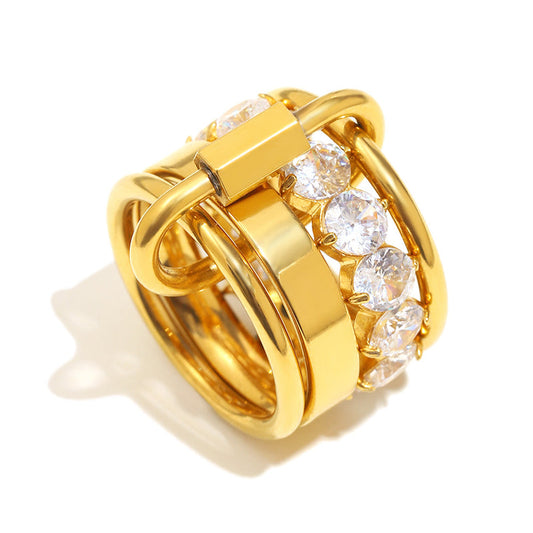 Gold ring with diamond accents on a white background