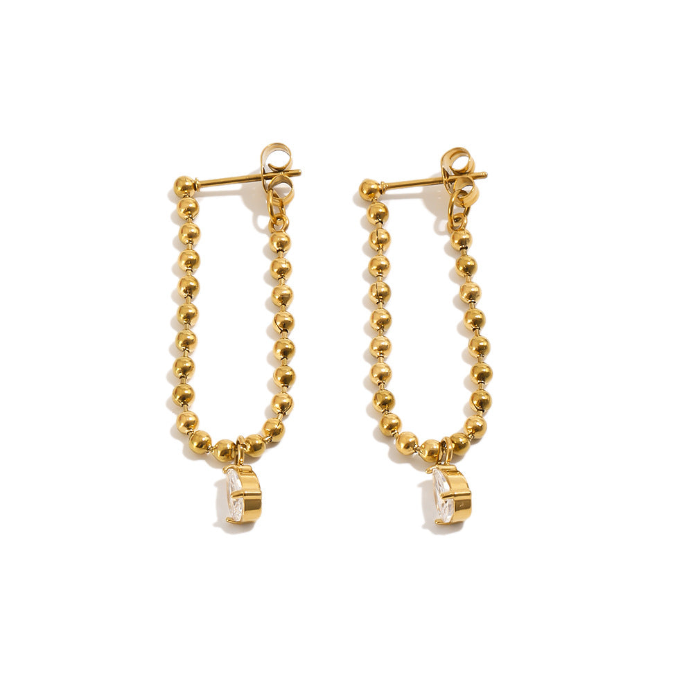 A pair of Beaded Chain Drop Earrings with beaded drop chains and small gold disc charms, photographed on a clean white background.