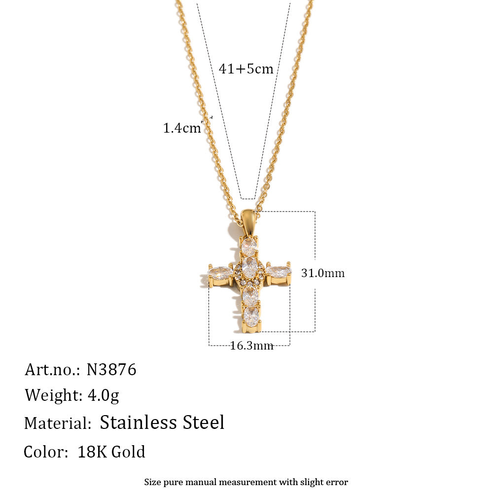 Gold cross pendant necklace with dimension markings showing 31.0mm height, 16.
