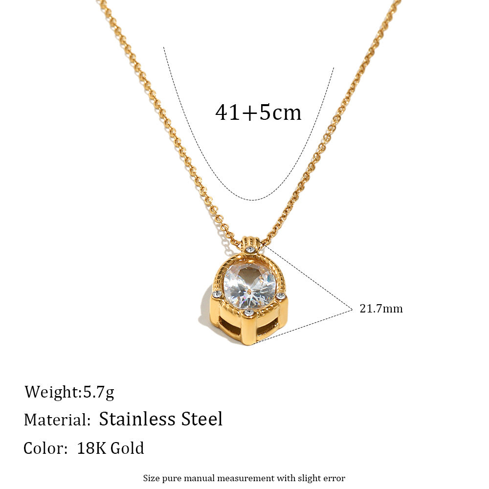 Gold necklace with a clear gemstone on a white background, showing measurements and material details.