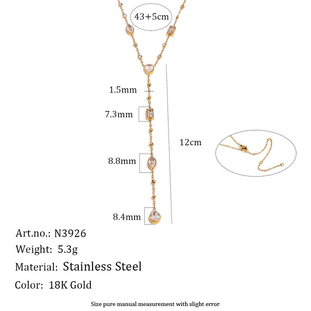 Gold-plated stainless steel pendant necklace with clear teardrop and rectangular crystals, shown with dimension measurements (12cm length, 1.5mm, 7.