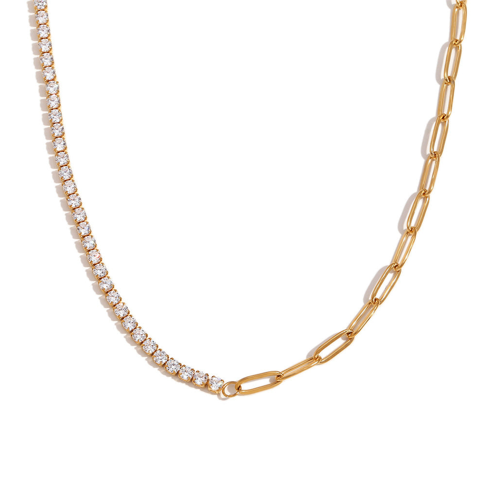 Gold chain necklace with diamond-like stones on a white background