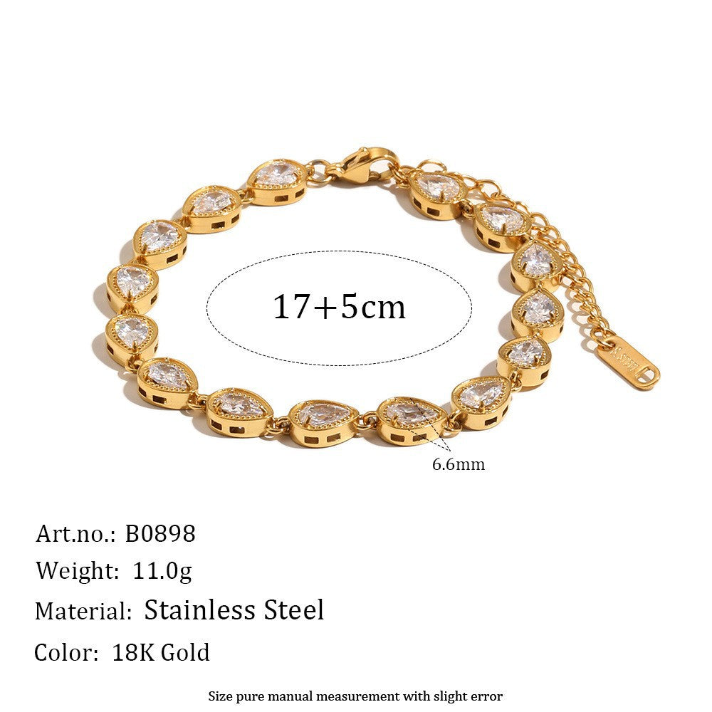 Gold bracelet with clear stones on a white background, showing measurements and product details.